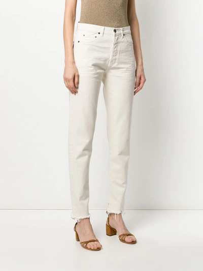 Shop Saint Laurent Distressed-hem Straight-leg Jeans In Neutrals