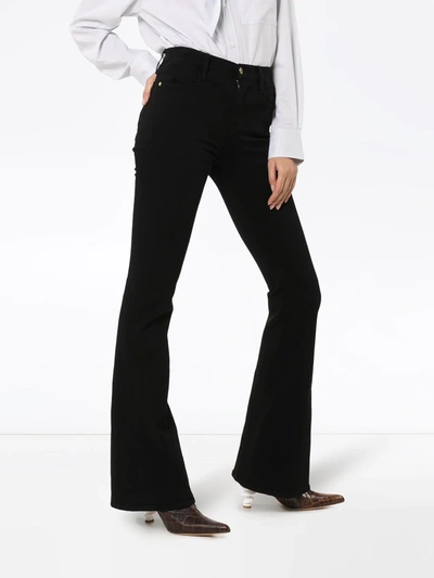 Shop Frame Le High Flared Jeans In Black