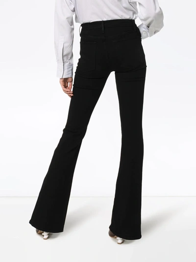 Shop Frame Le High Flared Jeans In Black