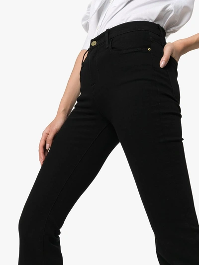 Shop Frame Le High Flared Jeans In Black