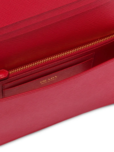 Shop Prada Saffiano Logo Plaque Mini Bag In Red