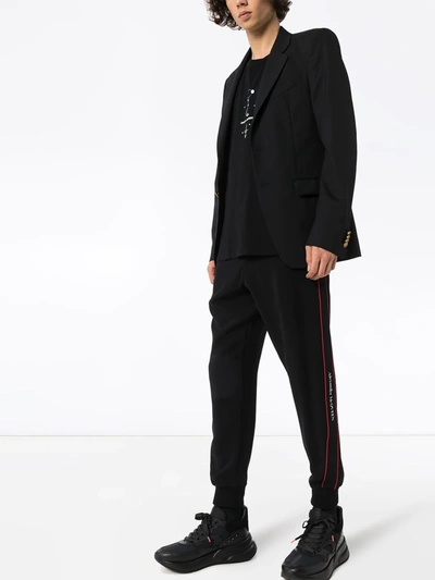 Alexander Mcqueen Logo Tape Track Pants In Black