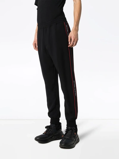 Alexander Mcqueen Logo Tape Track Pants In Black