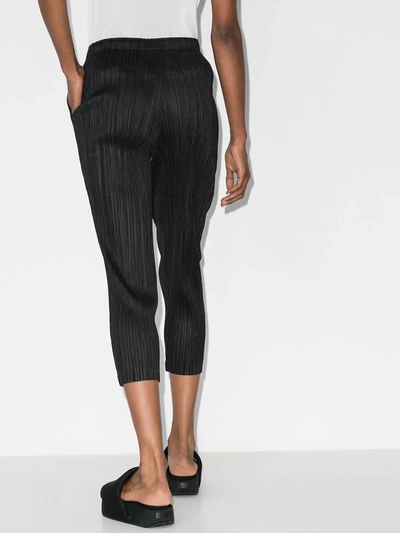 Shop Issey Miyake Plissé Cropped Trousers In Black