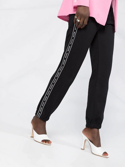 Msgm Embroidered Cotton-blend Fleece Track Pants In Black