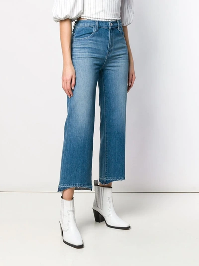 Shop J Brand Cropped Unfinished Hem Jeans In Blue