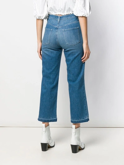 Shop J Brand Cropped Unfinished Hem Jeans In Blue