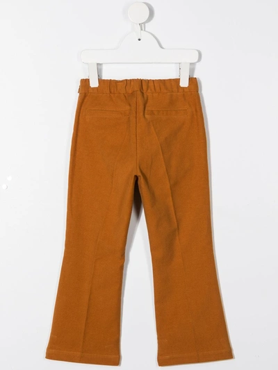 Shop Touriste Wide Leg Trousers In Orange