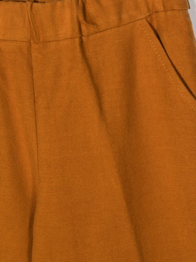 Shop Touriste Wide Leg Trousers In Orange