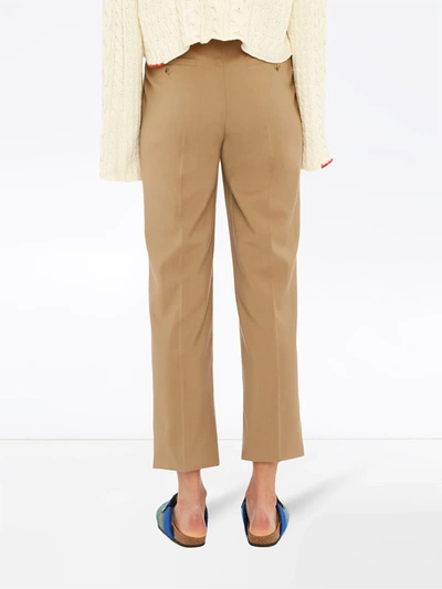 Shop Jw Anderson Cropped Belted Trousers In Neutrals