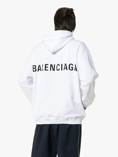 Shop Balenciaga Logo Print Oversized Hooded Jumper In White