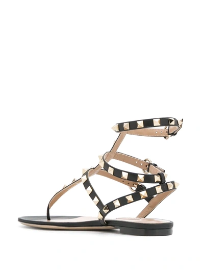 Shop Valentino Rockstud Caged Flat Sandals In Black