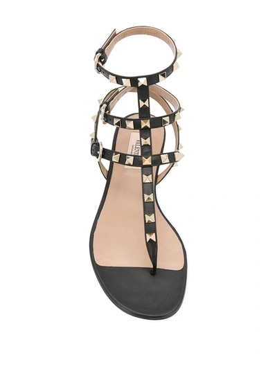 Shop Valentino Rockstud Caged Flat Sandals In Black