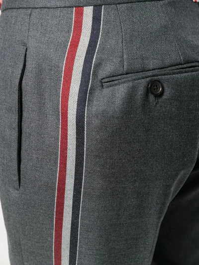 Shop Thom Browne Striped Low-rise Wool Trouser In Grey