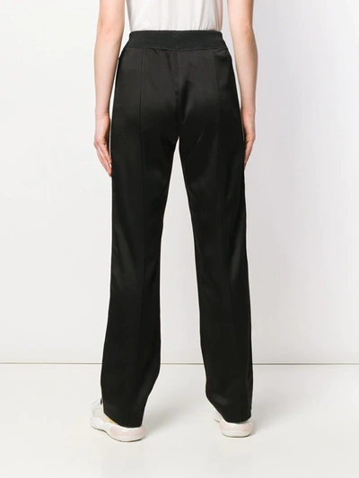 Shop Moncler Elasticated Logo Trousers In Black