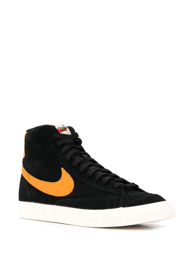Shop Nike Blazer Mid '77 "black/orange" Sneakers