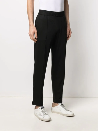 Shop Emporio Armani Pressed-crease Elasticated-waist Trousers In Black