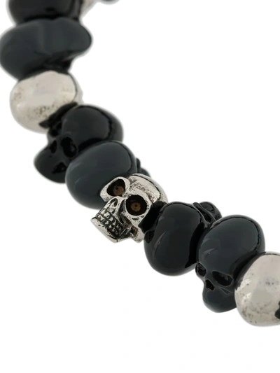 Shop Alexander Mcqueen Beaded Skull Bracelet In Black