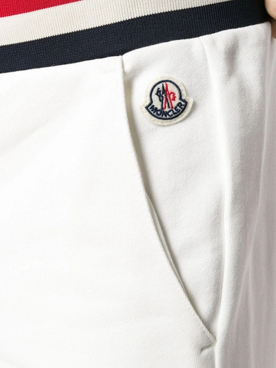 Shop Moncler Striped Waistband Trousers In White