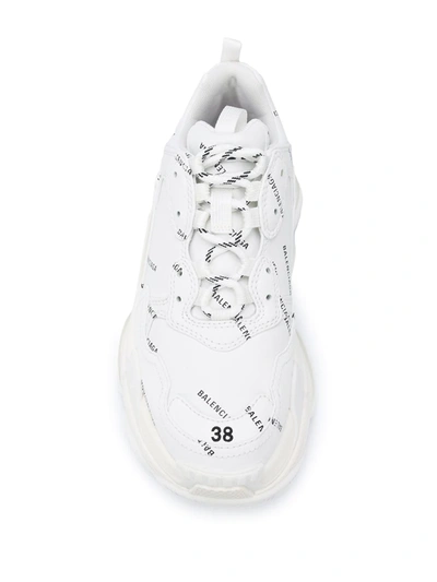 Shop Balenciaga All-over Logo Triple S Sneakers In White