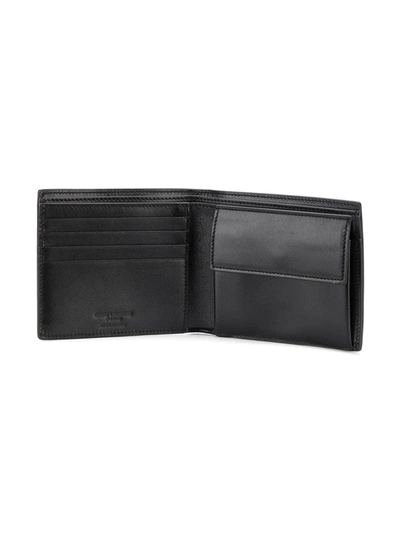 Shop Saint Laurent East/west Bifold Wallet In Black