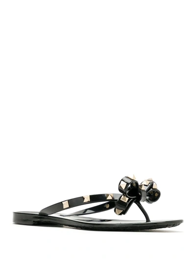 Shop Valentino Rockstud Thong Sandals In Black