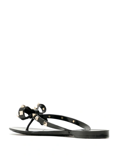 Shop Valentino Rockstud Thong Sandals In Black