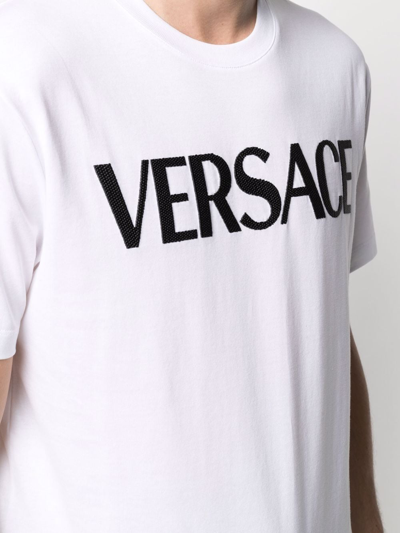 Shop Versace Logo-embroidered T-shirt In Weiss