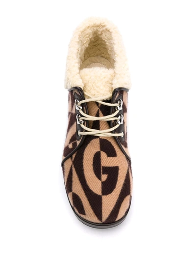 Shop Gucci Monogram Print 45mm Ankle Boots In Brown