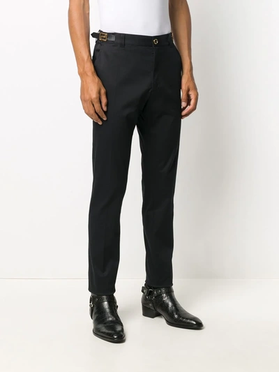Shop Versace Logo Tab Tailored Trousers In Black