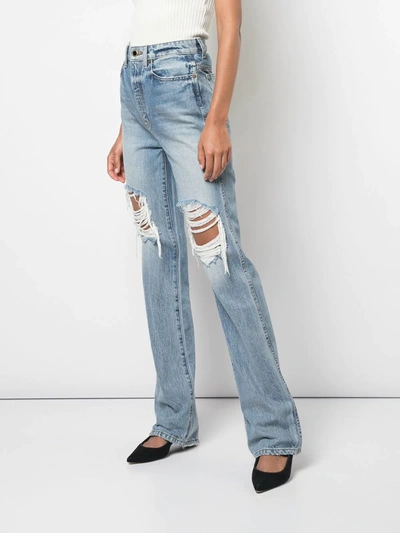 Shop Khaite High-waisted Distressed Jeans In Blue
