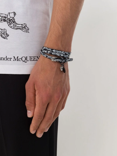 Shop Alexander Mcqueen Skull Graffiti Print Bracelet In Black