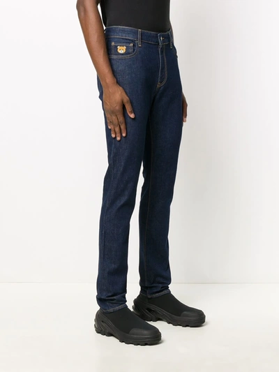 Shop Moschino Teddy Bear Patch Jeans In Blue