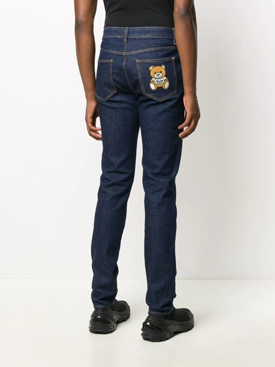 Shop Moschino Teddy Bear Patch Jeans In Blue