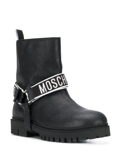 Shop Moschino Logo Band Ankle Boots In Black