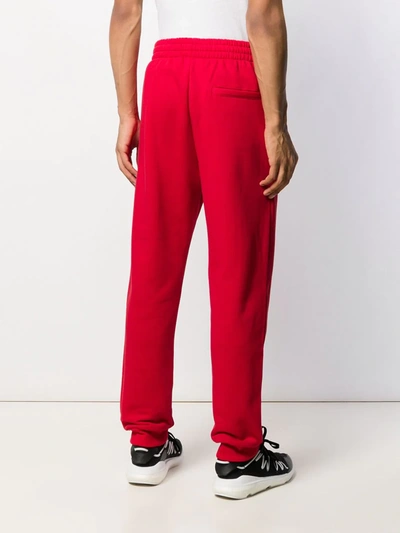 Shop Msgm Printed Logo Track Pants In Red