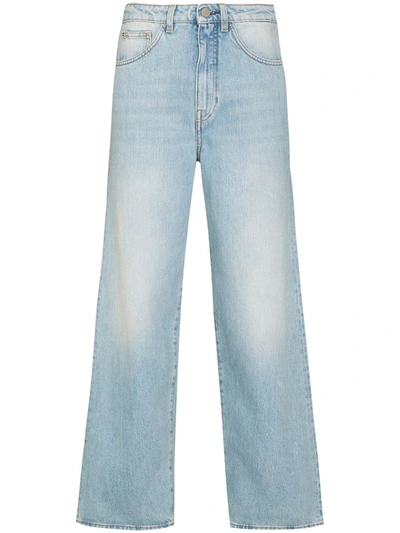 Shop Totême High-waisted Flared Jeans In Blue