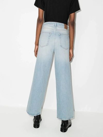 Shop Totême High-waisted Flared Jeans In Blue