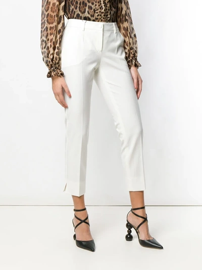 Shop Dolce & Gabbana Cropped Slim-fit Trousers In White