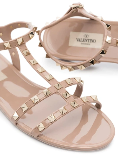 Shop Valentino Rockstud Flat Sandals In Neutrals