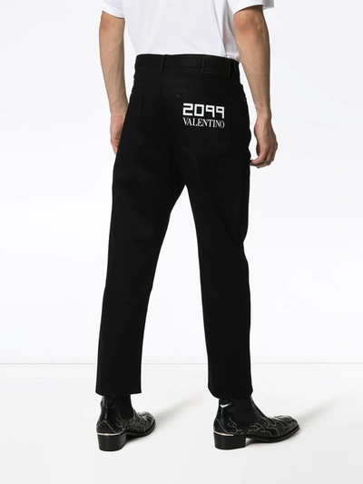 Shop Valentino 2099 Logo Print Slim Jeans In Black