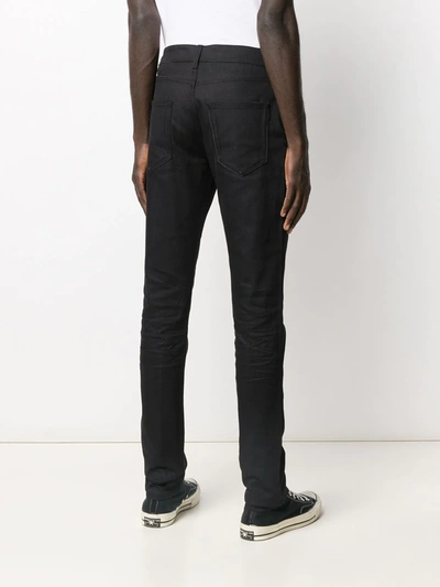 Shop Saint Laurent Creased Skinny Jeans In Black
