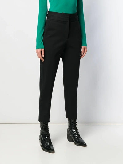 Shop Sandro High-waisted Trousers In Black