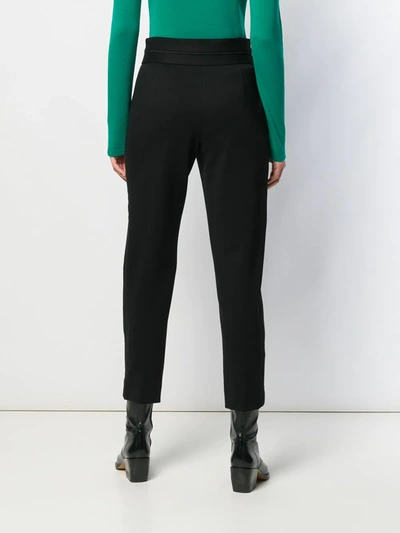 Shop Sandro High-waisted Trousers In Black