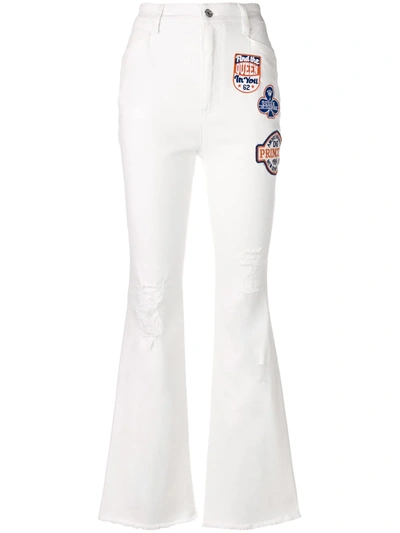 Shop Dolce & Gabbana Applique Patch Flared Jeans In White