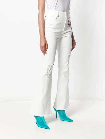 Shop Dolce & Gabbana Applique Patch Flared Jeans In White