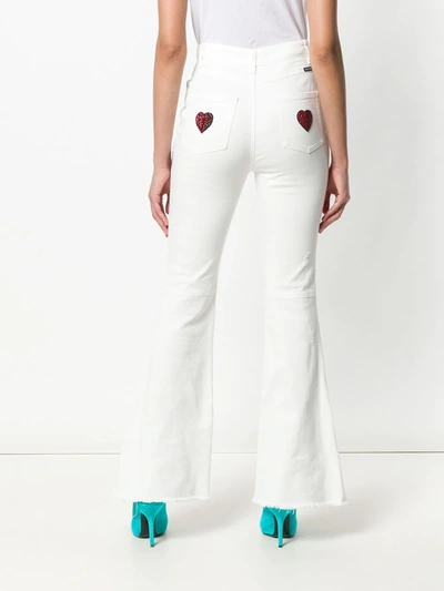 Shop Dolce & Gabbana Applique Patch Flared Jeans In White