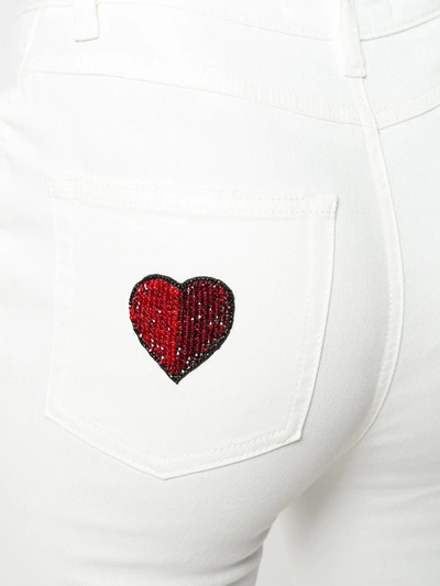 Shop Dolce & Gabbana Applique Patch Flared Jeans In White