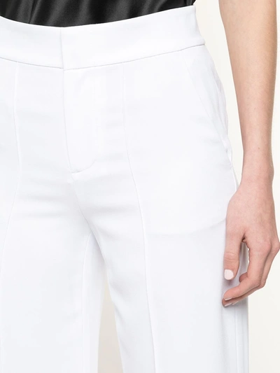 Shop Alice And Olivia High-waist Slim-fit Trousers In White