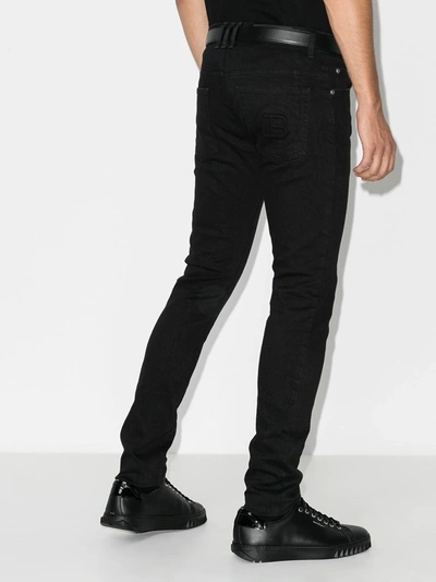 Shop Balmain Mid-rise Slim-leg Jeans In Black